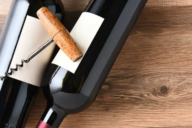 Top view of wine bottles and corkscrew with copy space.