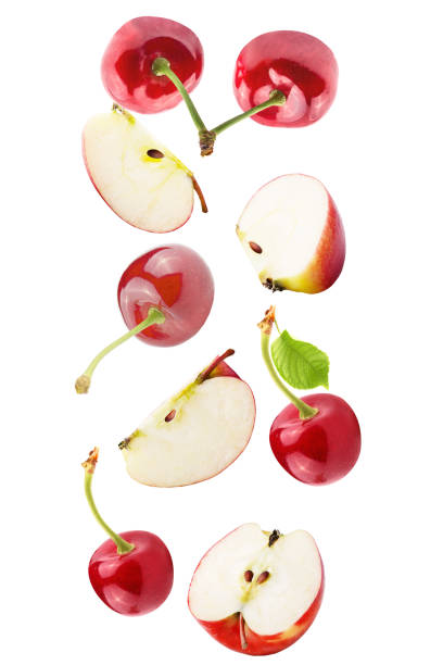 istock Isolated falling fruits. Falling apple and cherries isolated on white background with clipping path as package design element 950866914
