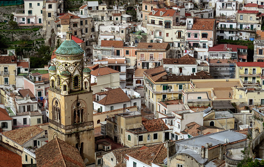 elevated view of an old village on the amalfi coast with a landmark church in the foreground, Amalfi Coast, Italy