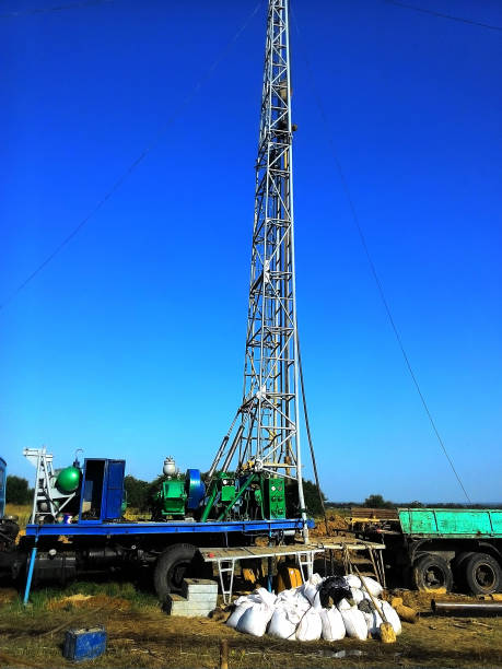 istock Drilling a well to extract water and provide it with a population 950869618