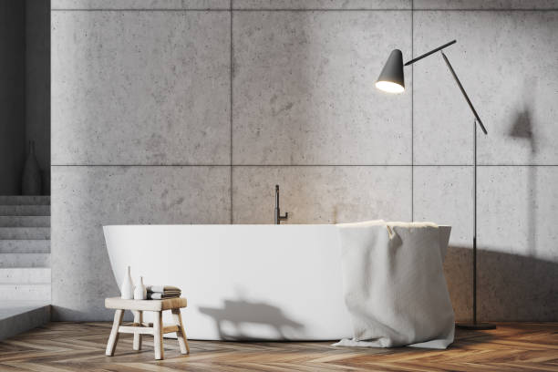 istock Gray bathroom interior, white tub close up 950875062