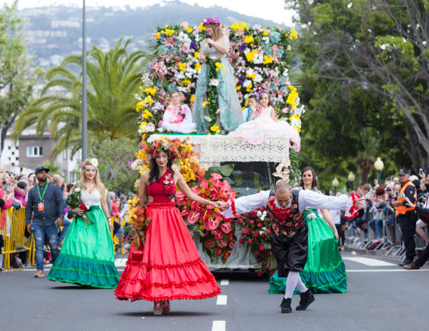 parade of madeira flower festival or "festa da flor" in funchal city, madeira island, portugal, april 2018. - flower parade imagens e fotografias de stock