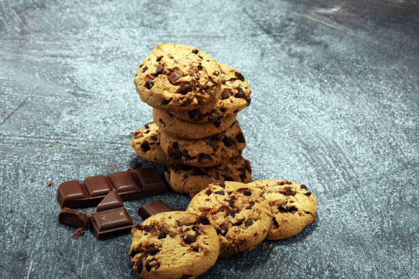 istock Chocolate cookies on rustic table. Chocolate chip cookies 950879632