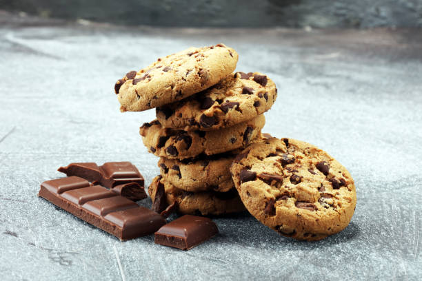 istock Chocolate cookies on rustic table. Chocolate chip cookies 950879794