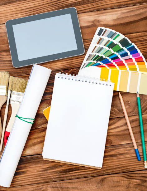 istock Designer's workspace with blank notepad, color swatches book and tablet PC. 950882746