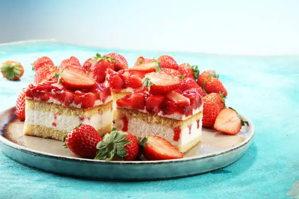 strawberry cake with fresh strawberries and whipped cream