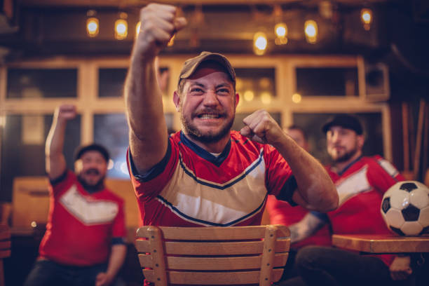 istock Soccer fan in pub 950883250