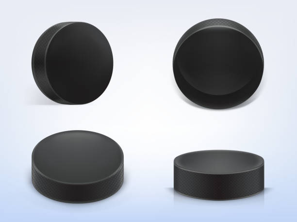 Vector set of black rubber pucks for play hockey Vector set of 3d realistic black rubber pucks for play ice hockey isolated on light background. Sport equipment, hard round disk, inventory for winter team game on skating rink hockey puck stock illustrations