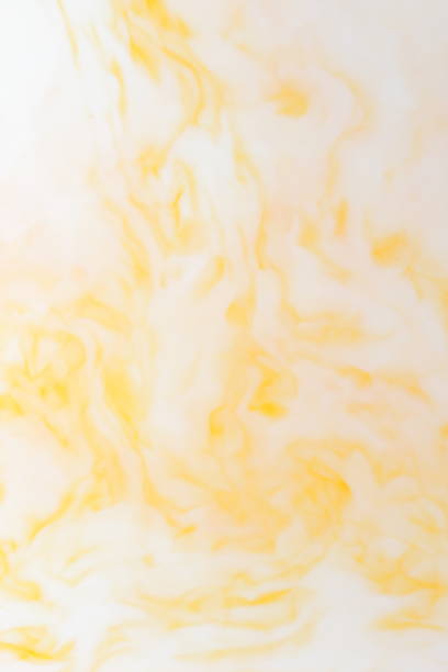 istock Yellow white abstract background, yellow pattern of paints on liquid, blank for designer, paint divorces in milk, bright texture on white background, minimalism, creative blank for wallpaper 950884170