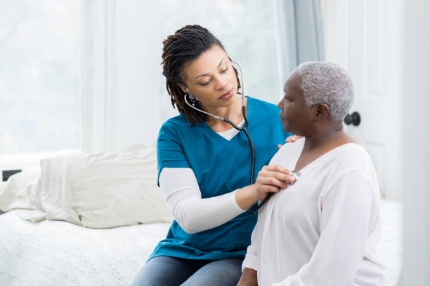 istock Home healthcare nurse examines elderly patient 950886826