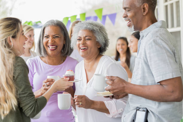 Friends enjoy coffee and cake at fundraising event