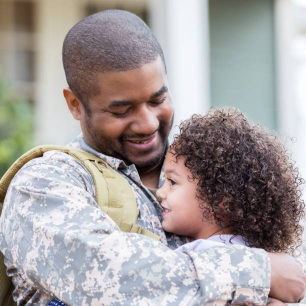 istock Soldier dad is welcomed home by his daughter 950887064