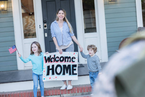 istock Family greets dad upon return home from military assignment 950887134