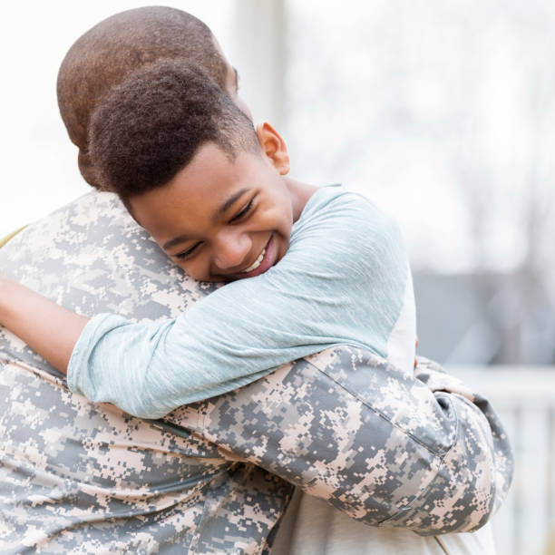 istock Boy is excited for his military dad's return 950887182