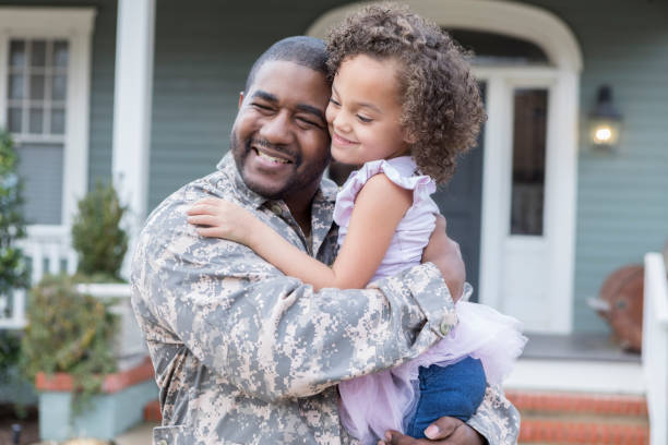 istock Soldier hugs his adorable daughter 950887190