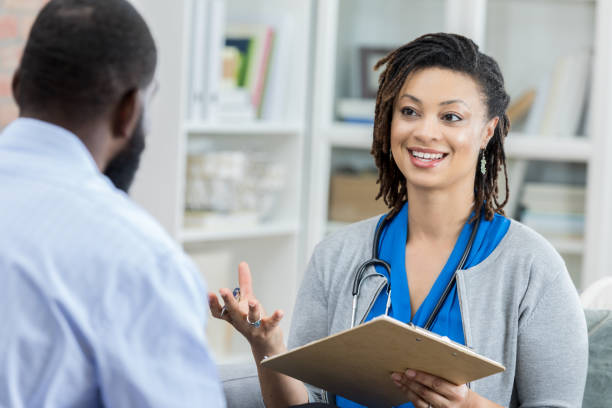 istock Confident doctor discusses diagnosis with patient 950887272