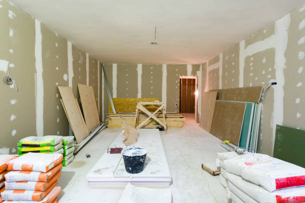 istock Materials for construction putty packs, sheets of plasterboard or drywall in apartment is under construction, remodeling, renovation, extension, restoration and reconstruction 950887472