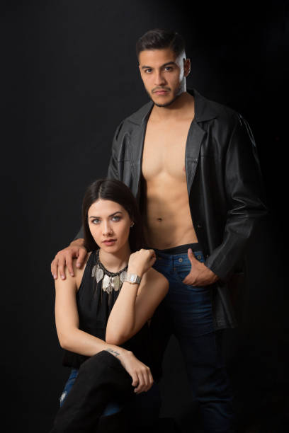 istock She is Setting He Stands Behind Her Looking at Camera Couple Portrait Close-Up 950891068