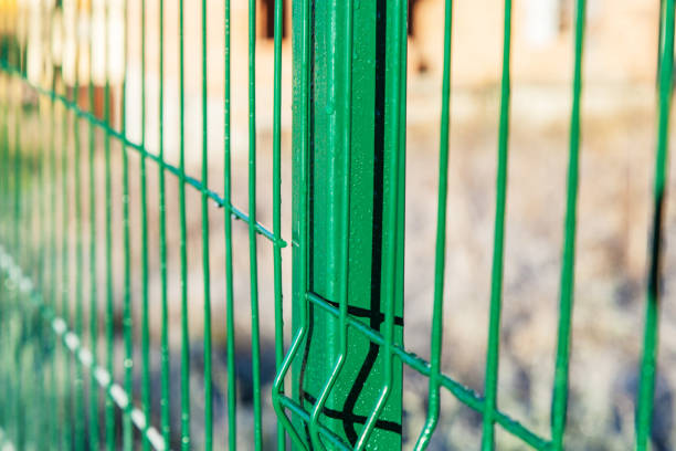 istock Fragment of the fence is covered with dew drops 950892142