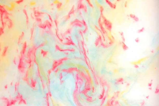 istock Multicolored abstract background, multicolored pattern of paints on liquid, blank for designer, paint divorces in milk, bright texture on white background, minimalism, creative blank for wallpaper 950892190
