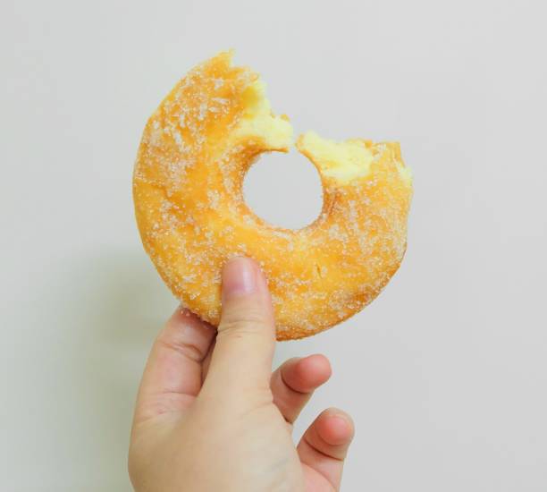 istock Hand Holding Delicious Glazed Donut with Sugar 950895616