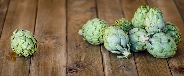 artichokes on wooden table