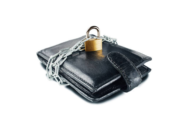 istock Leather wallet with lock and chain on white isolated background. Concept of protecting electronic money and safety personal finances. Financial  security  in cashless and cash settlements. 950903578