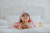 Baby girl in pink bathrobe