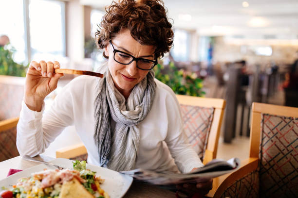 istock Woman having lunch at a restaurant 950911352