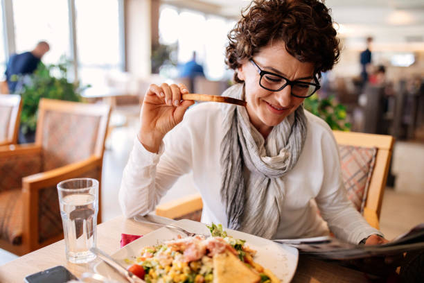 istock Woman having lunch at a restaurant 950911416