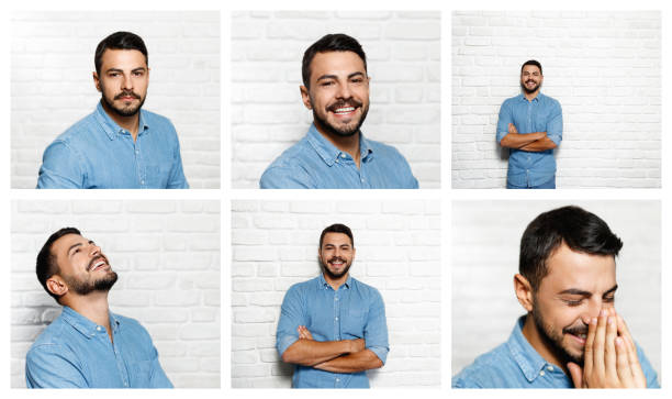 istock Facial Expressions Of Young Beard Man On Brick Wall 950914072