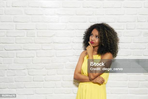 Facial Expressions Of Young Black Woman On Brick Wall Stock Photo - Download Image Now