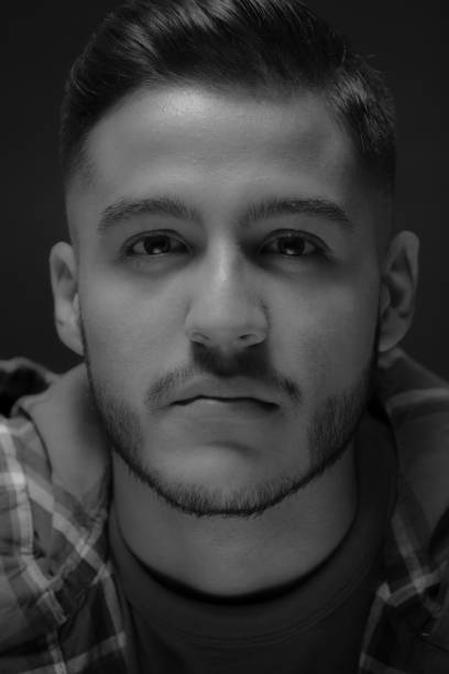 istock Young Guy Extreme Close-up Portrait in Monochrome 950915354