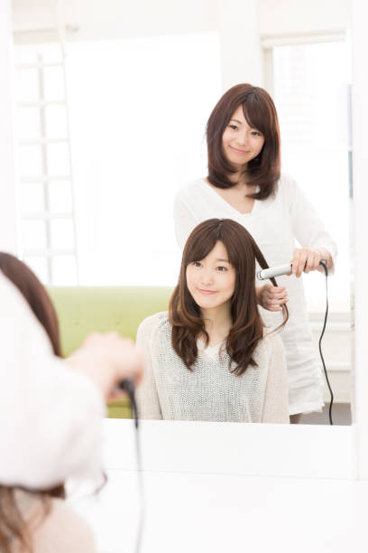 istock attractive asian woman in front of mirror 950918500