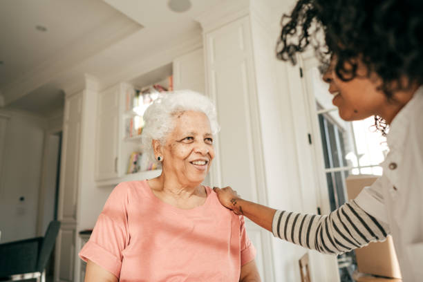 istock Nurse visiting senior lady at home 950931108