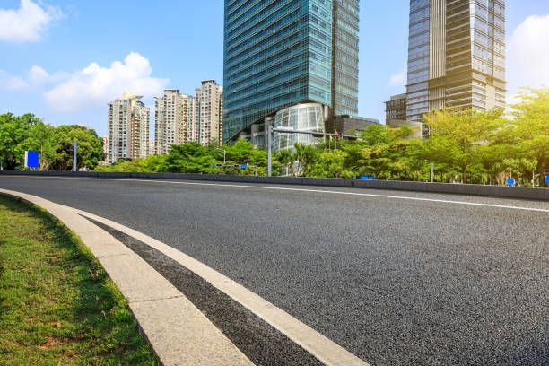istock asphalt road and modern commercial buildings 950931318