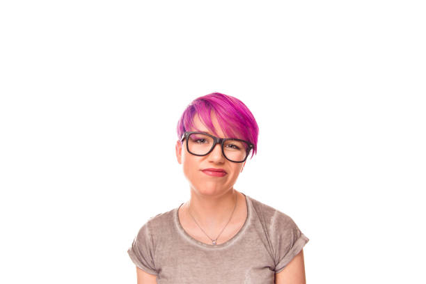 istock female pouts lips skeptical looking at you camera with discontent expression 950931866