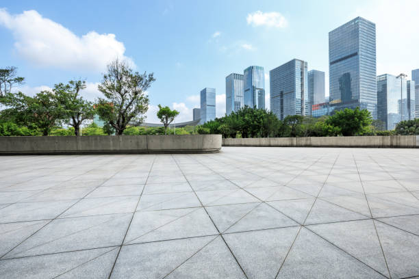 istock empty square floor and modern commercial buildings 950938820