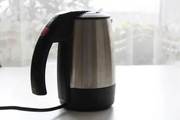 Electric kettle on a light background in a home setting, slose-up.