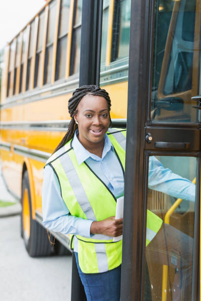 istock Driver climbing onto school bus 950953460