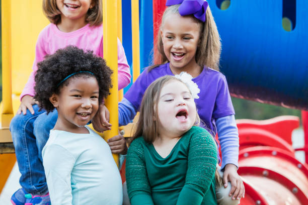 istock Multi-ethnic girls playing on playground 950956846