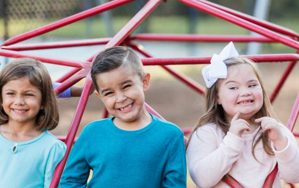 istock Multi-ethnic school children on playground monkey bars 950957998