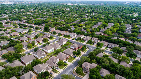 Real estate market Aerial drone view high above suburb homes in Austin , Texas