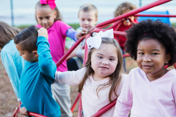 istock Multi-ethnic school children on playground monkey bars 950958626