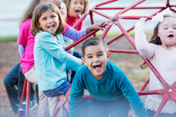 children playing on playground monkey bars - child jungle gym playground laughing imagens e fotografias de stock