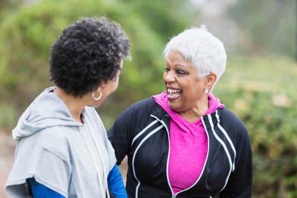 istock Two African-American women laughing together 950961092