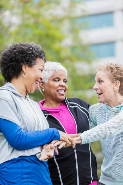 istock Three older multi-ethnic women hanging out together 950961398