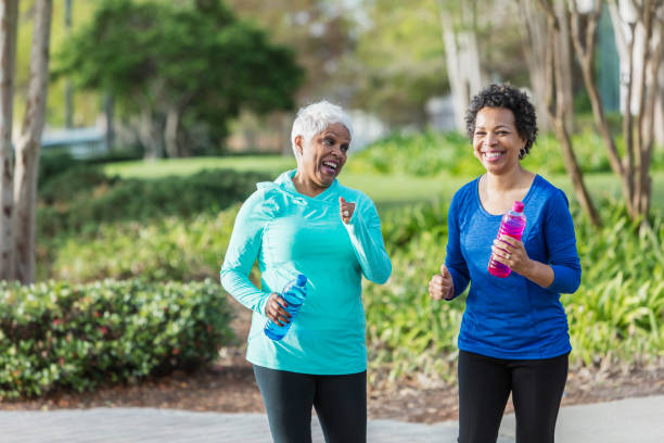 istock Two mature African-American women exercising, walking 950961742