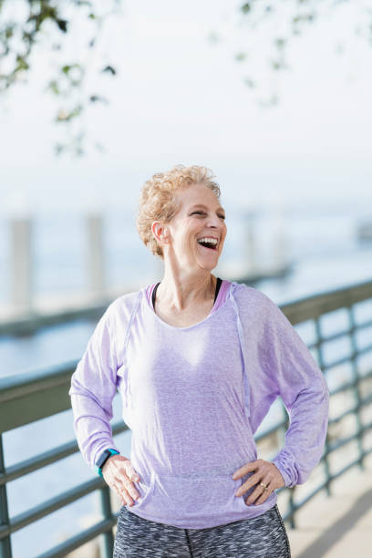 istock Senior woman exercising on city waterfront 950961888