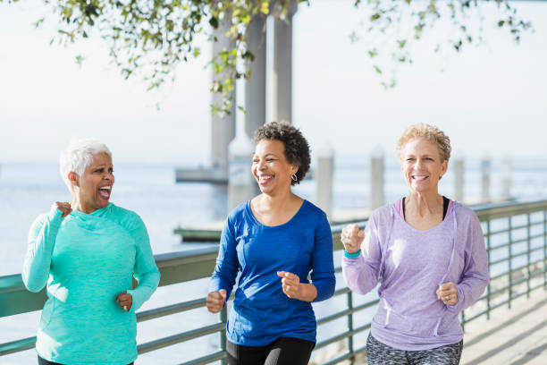 istock Three mature and senior women running on waterfront 950962028